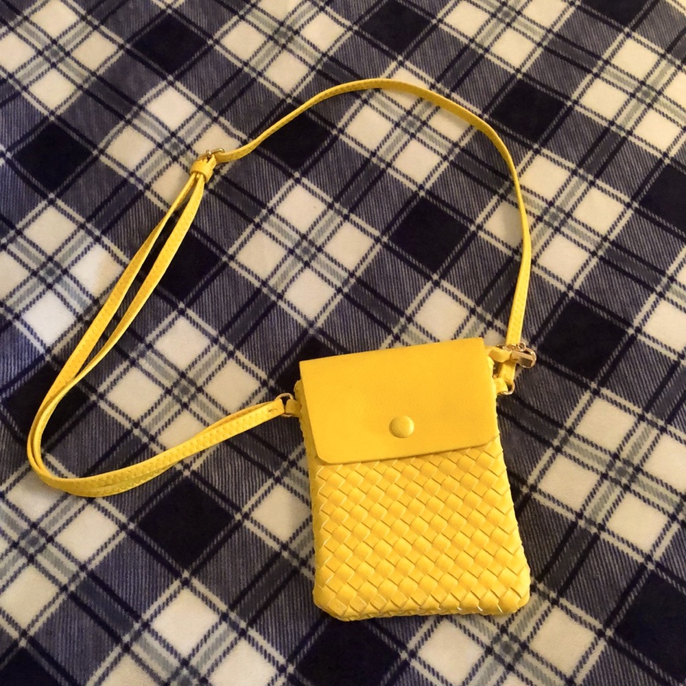 Crossbody bag, 8” high x 5” wide, 4 pockets inside. NWT.